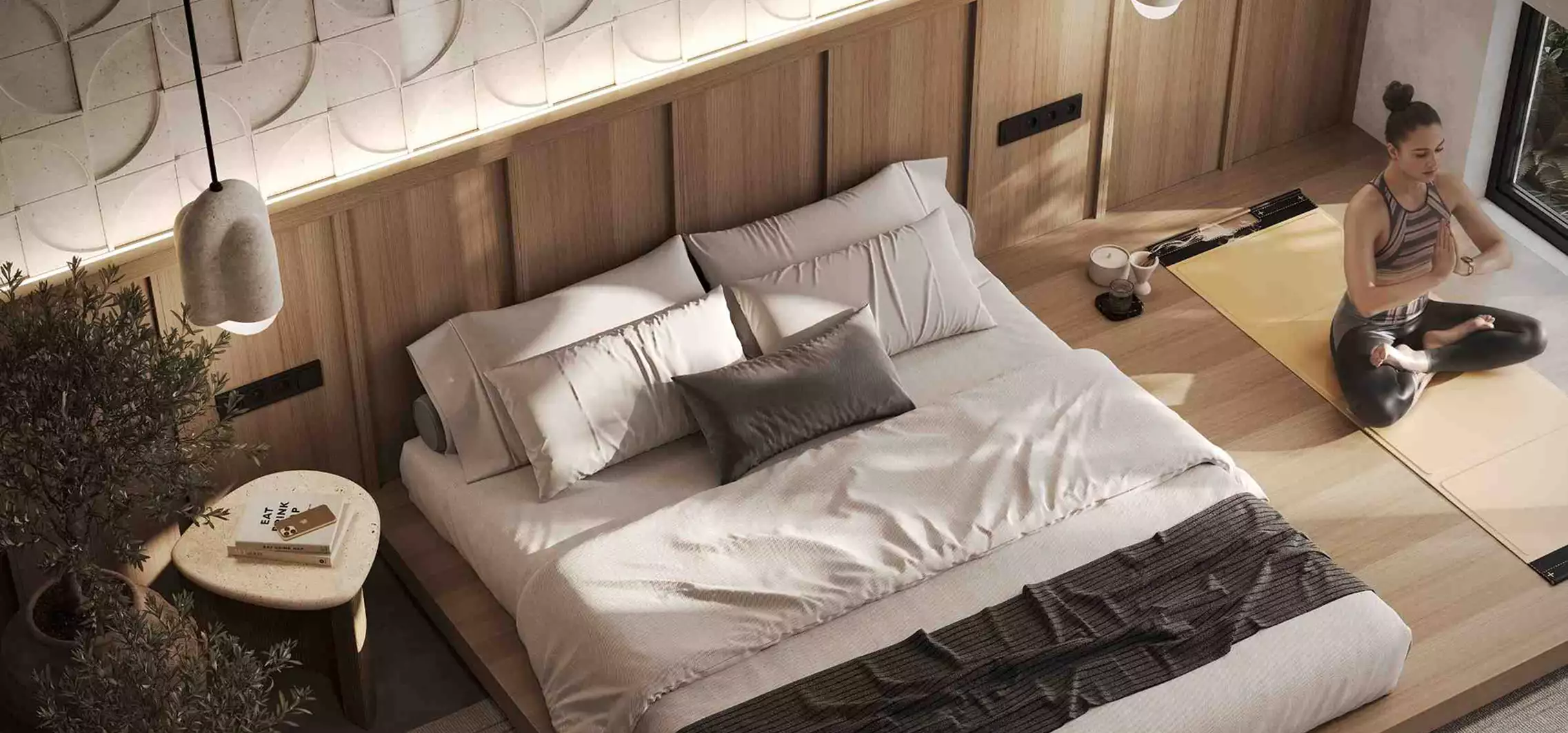 Residence interior design of a bedroom with a low bed, wood headboard, pendant light, and yoga area