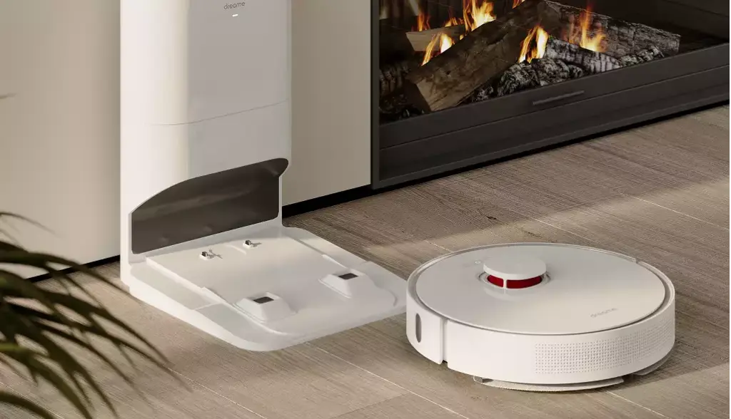 Robotic vacuum cleaner design with docking station placed on floor near modern fireplace in home interior