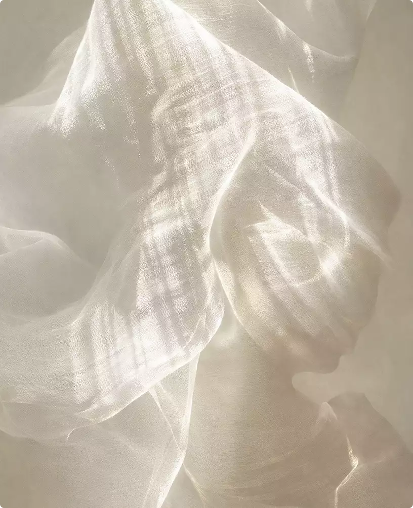 Robotic vacuum cleaner design cleaning near sheer fabric curtain with sunlight patterns in modern home interior