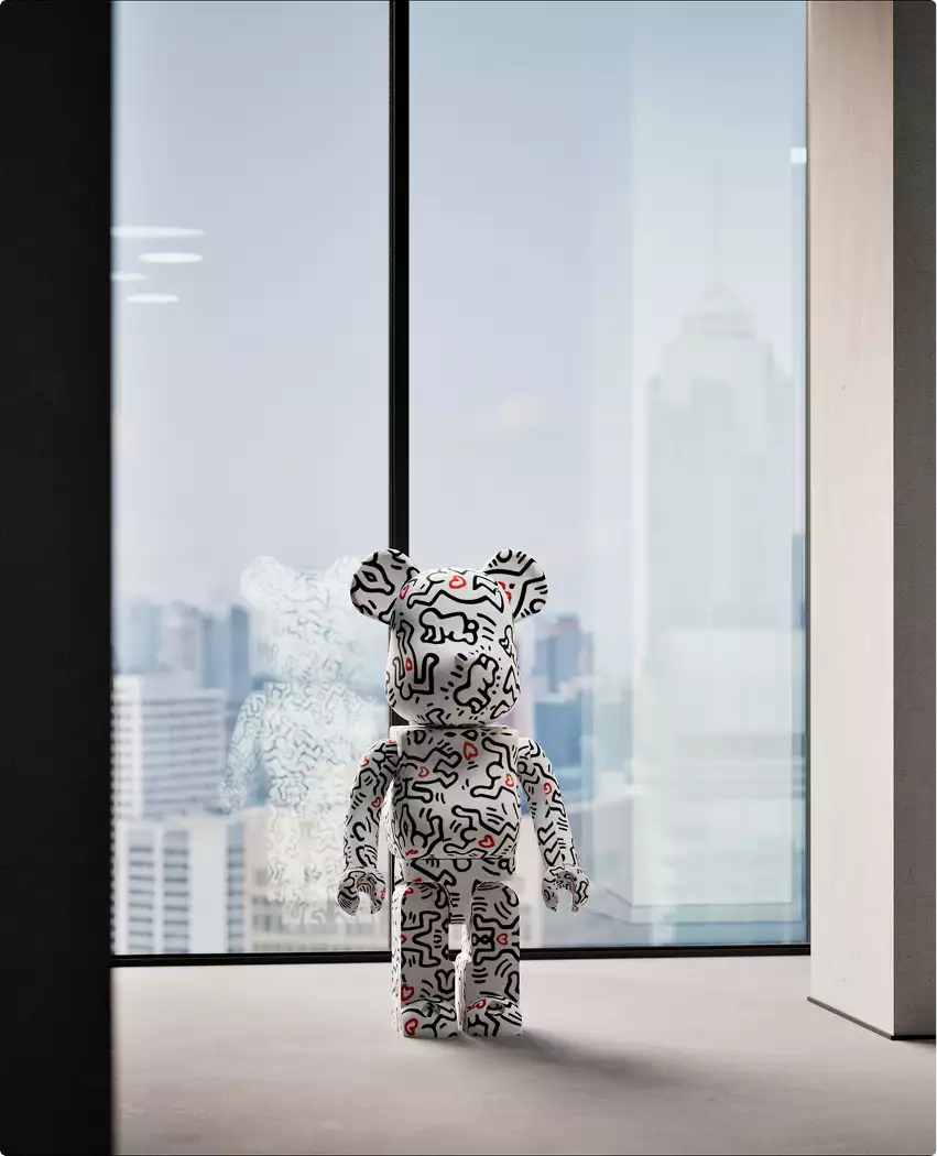 Patterned bear sculpture in skyscraper renders by tall window with soft city skyline in background.