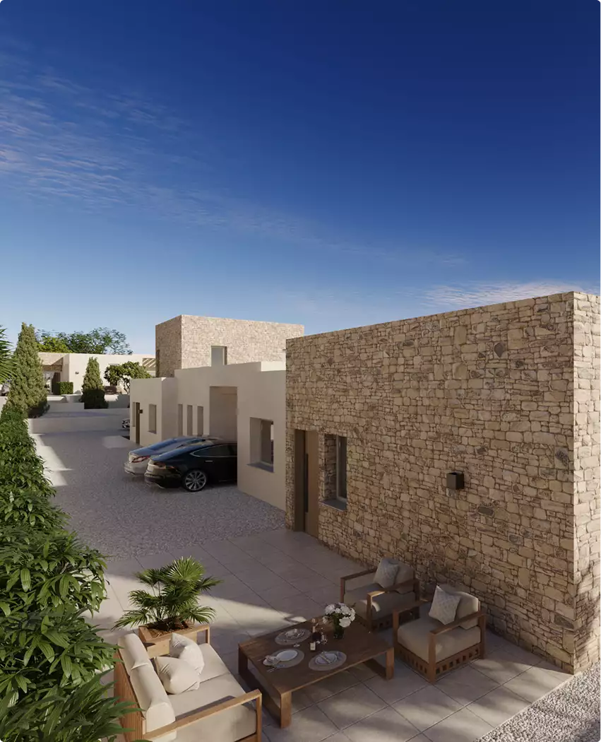 Stone patio and townhouse exterior, multifamily residential rendering, with parked cars and seating