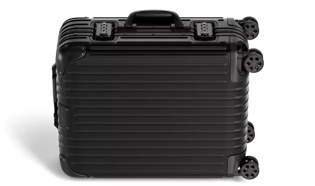 Suitcase 3d model showing a black hard-shell case laid flat with four wheels visible