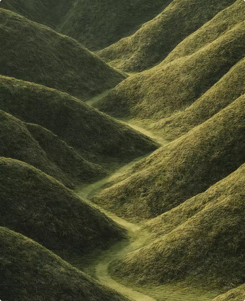 Undulating green hills with winding path in tennis court design landscape context