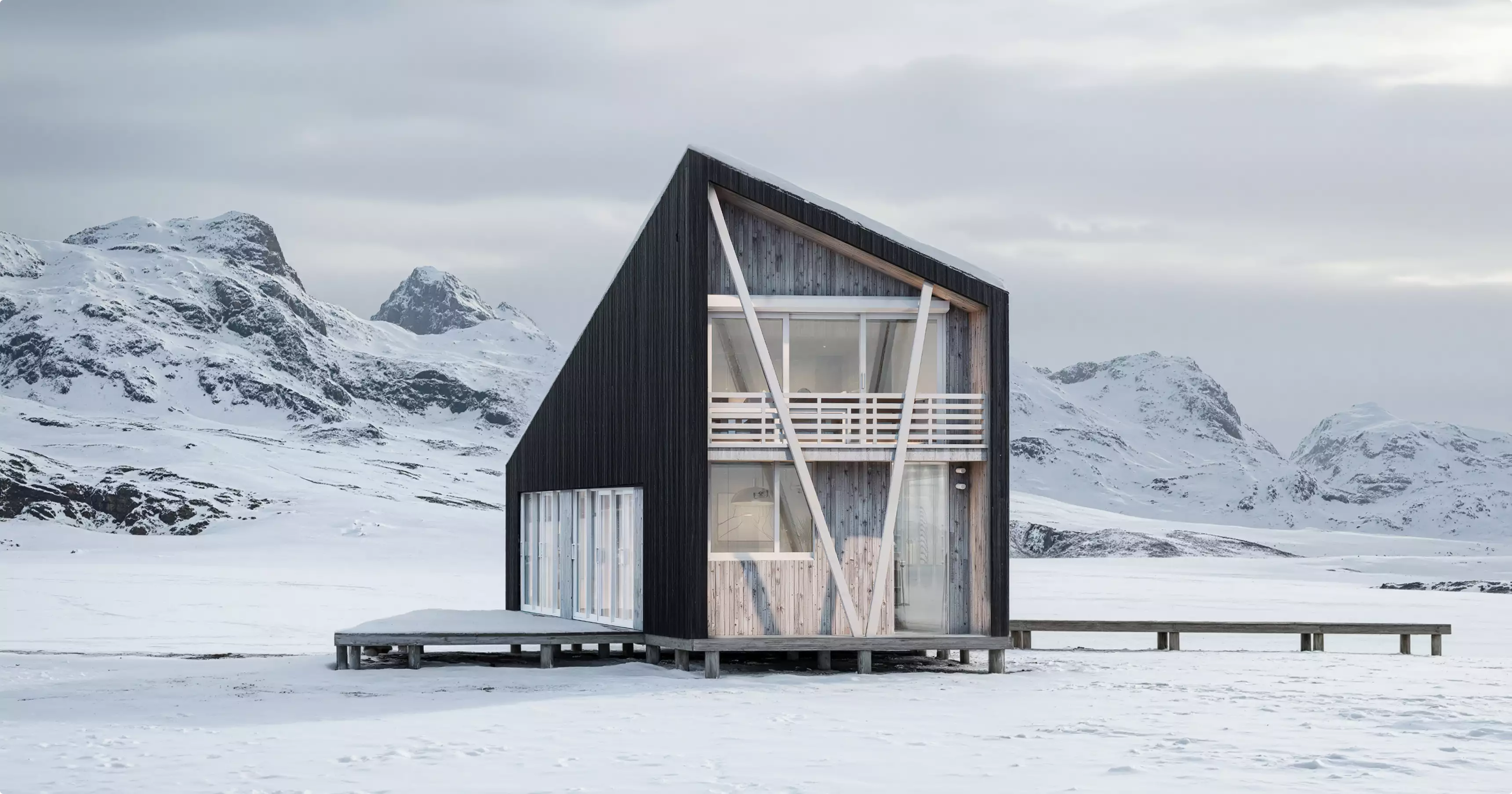 Winter exterior of a modern black cabin with a glass facade in a snowy mountain landscape