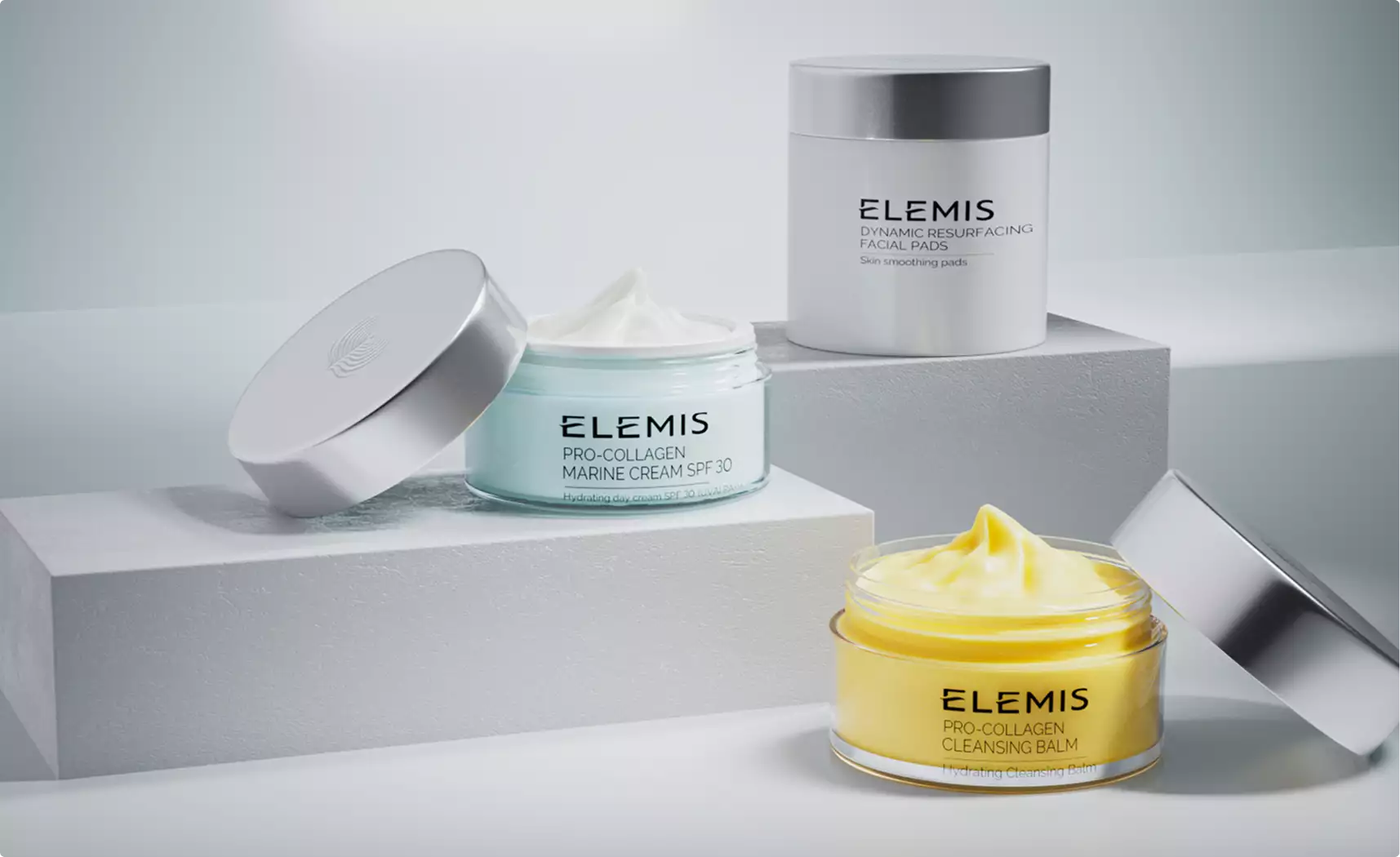 3d cosmetic skincare jars on white blocks with cream textures and lids displayed in minimal studio setting