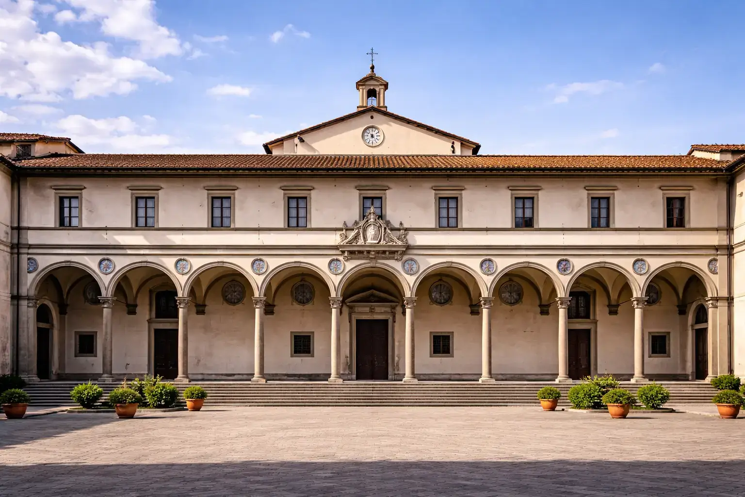 Arcaded Renaissance courtyard with balanced proportions and a long symmetrical facade