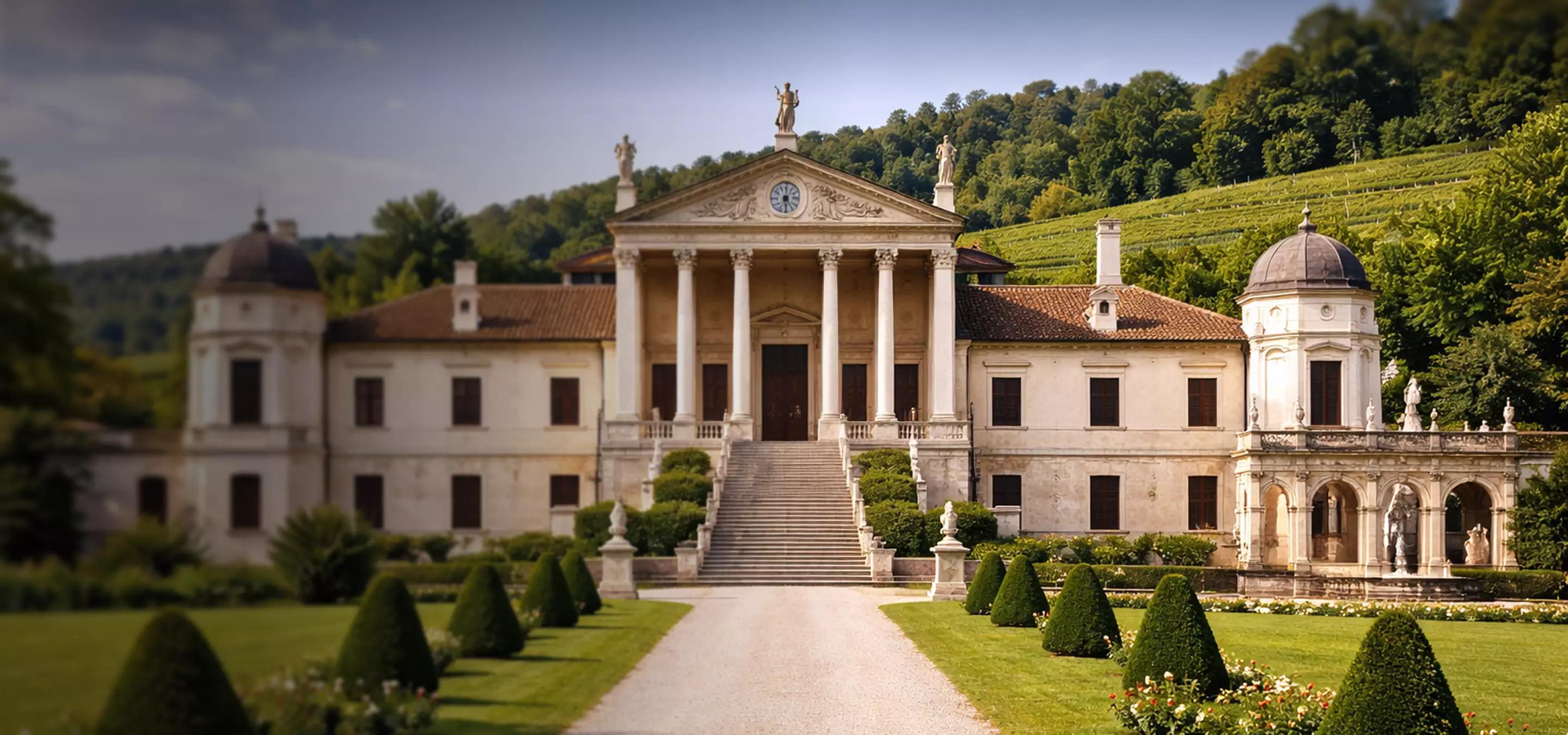 Grand Renaissance villa with a central portico and formal garden path