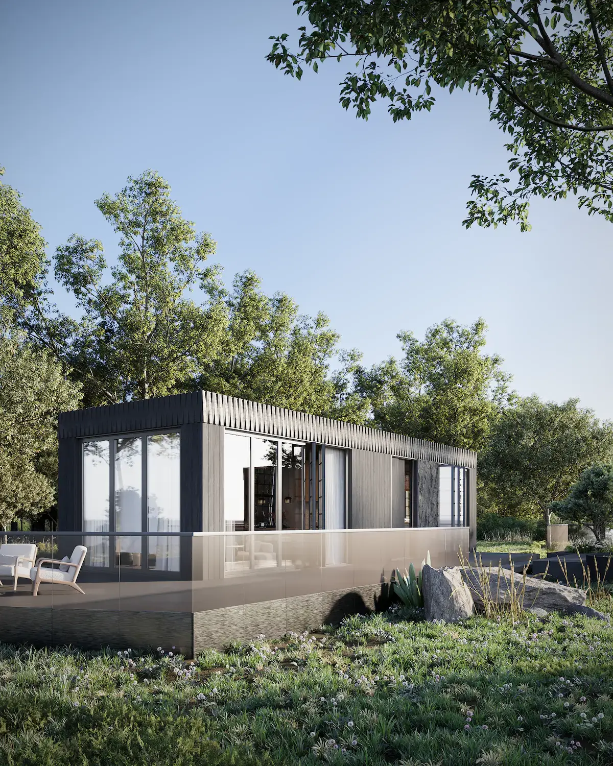 single-story modular home with glass terrace surrounded by trees