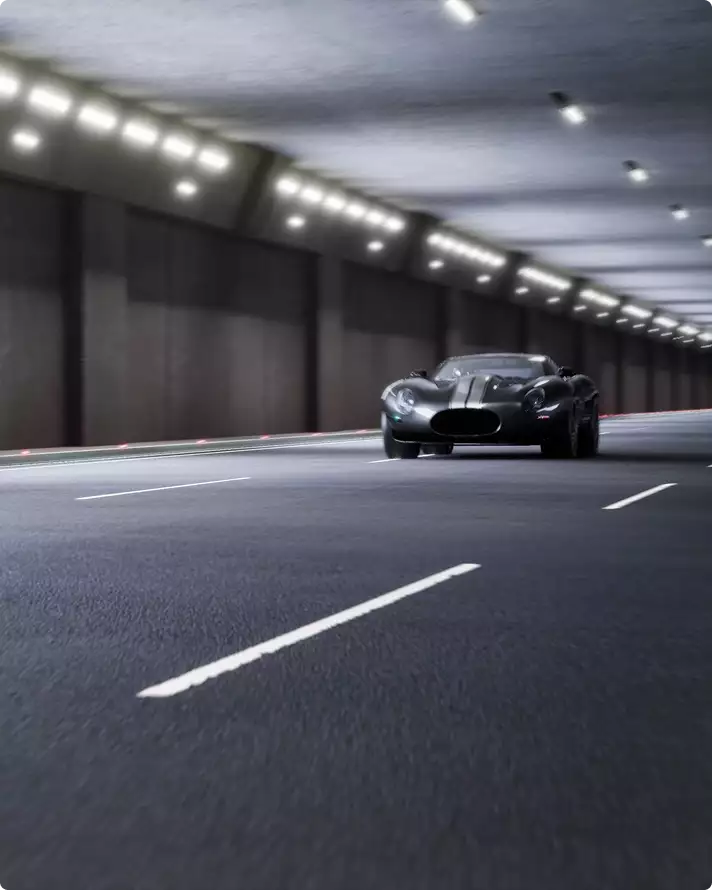Automotive CGI rendering service dark sports car driving in a wide tunnel with lane markings