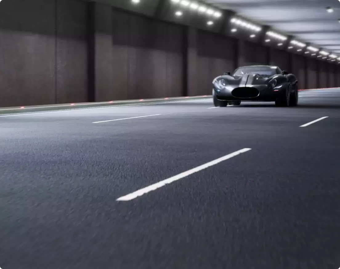 Automotive photorealistic CGI service dark sports car driving through a lit tunnel, wide front view