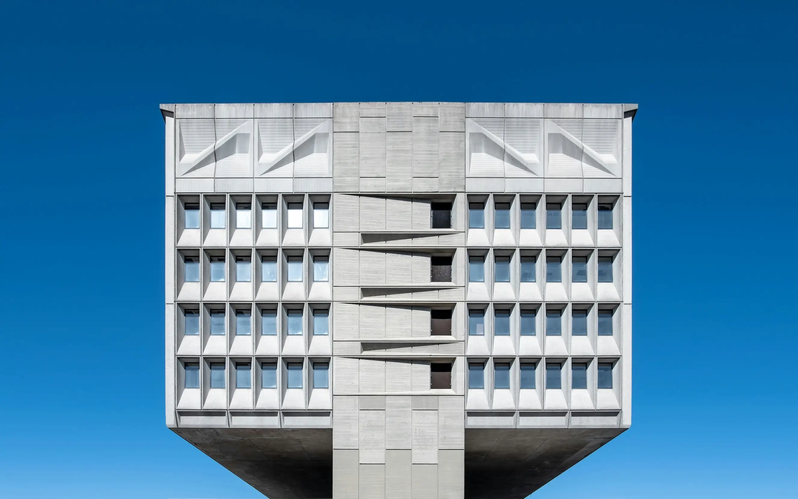 brutalist architecture example with exposed concrete and geometric facade