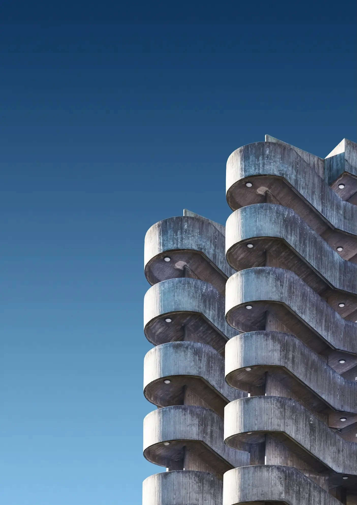 brutalist residential building with repetitive concrete balconies
