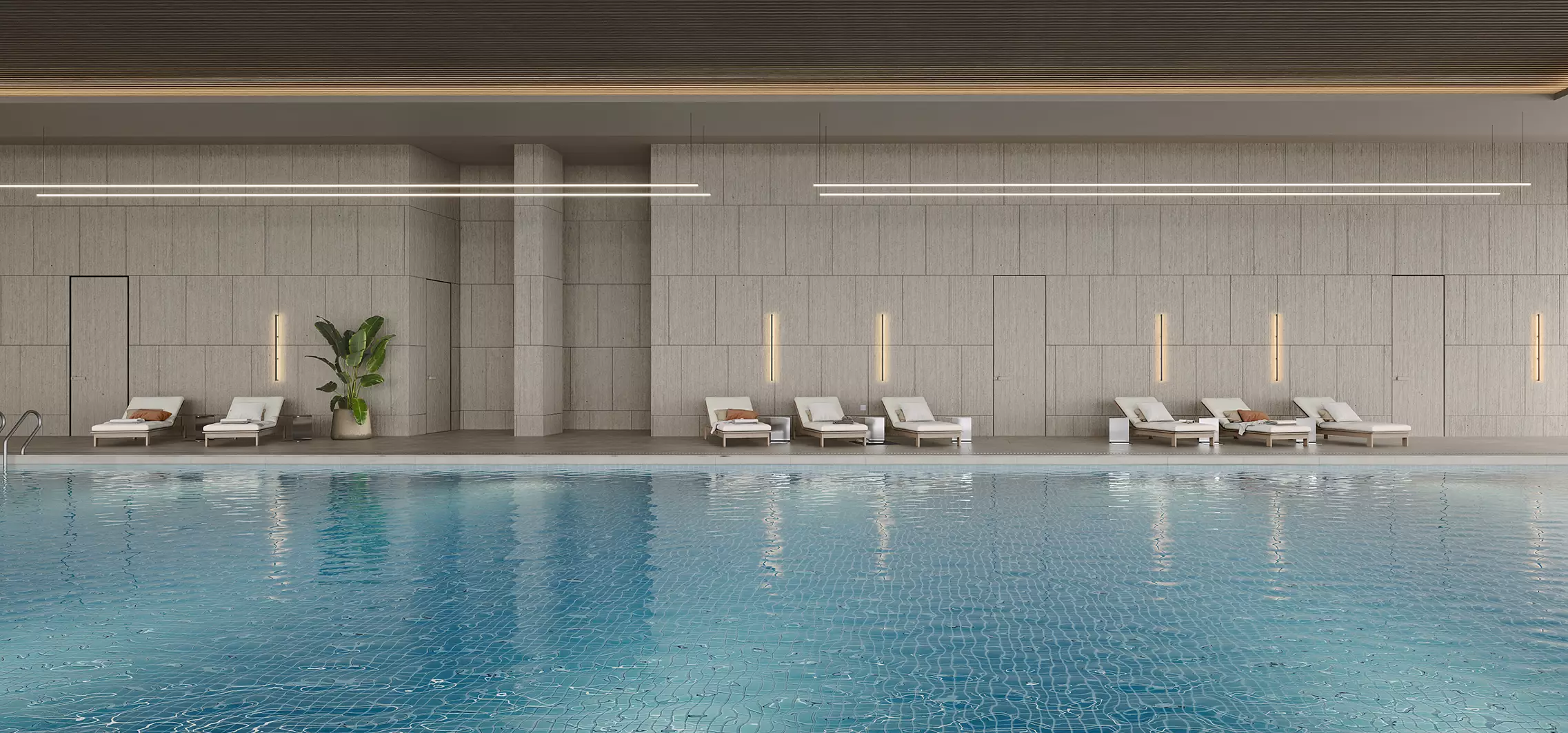 Indoor pool area fitness center interior design with lounge chairs, tiled walls, and calm water surface