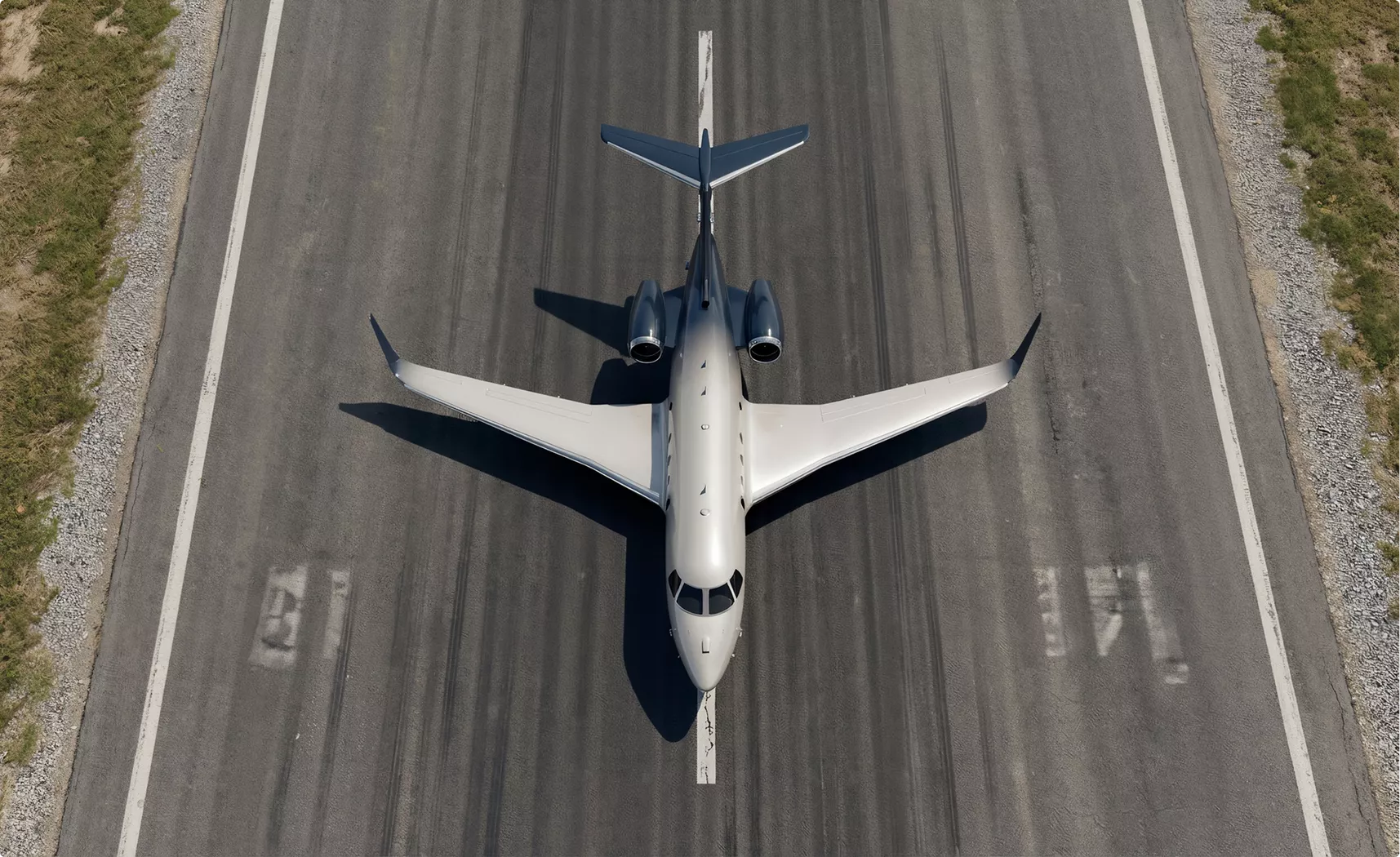 Gulfstream G450 design jet from above on runway centerline with wings spread and twin rear engines