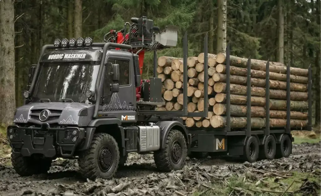 Logging machine product visualization truck carrying stacked logs in dense forest setting