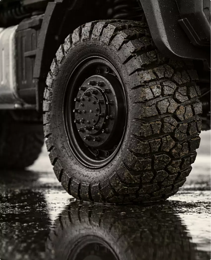 Logging machine product visualization off road tire with deep tread on wet ground surface