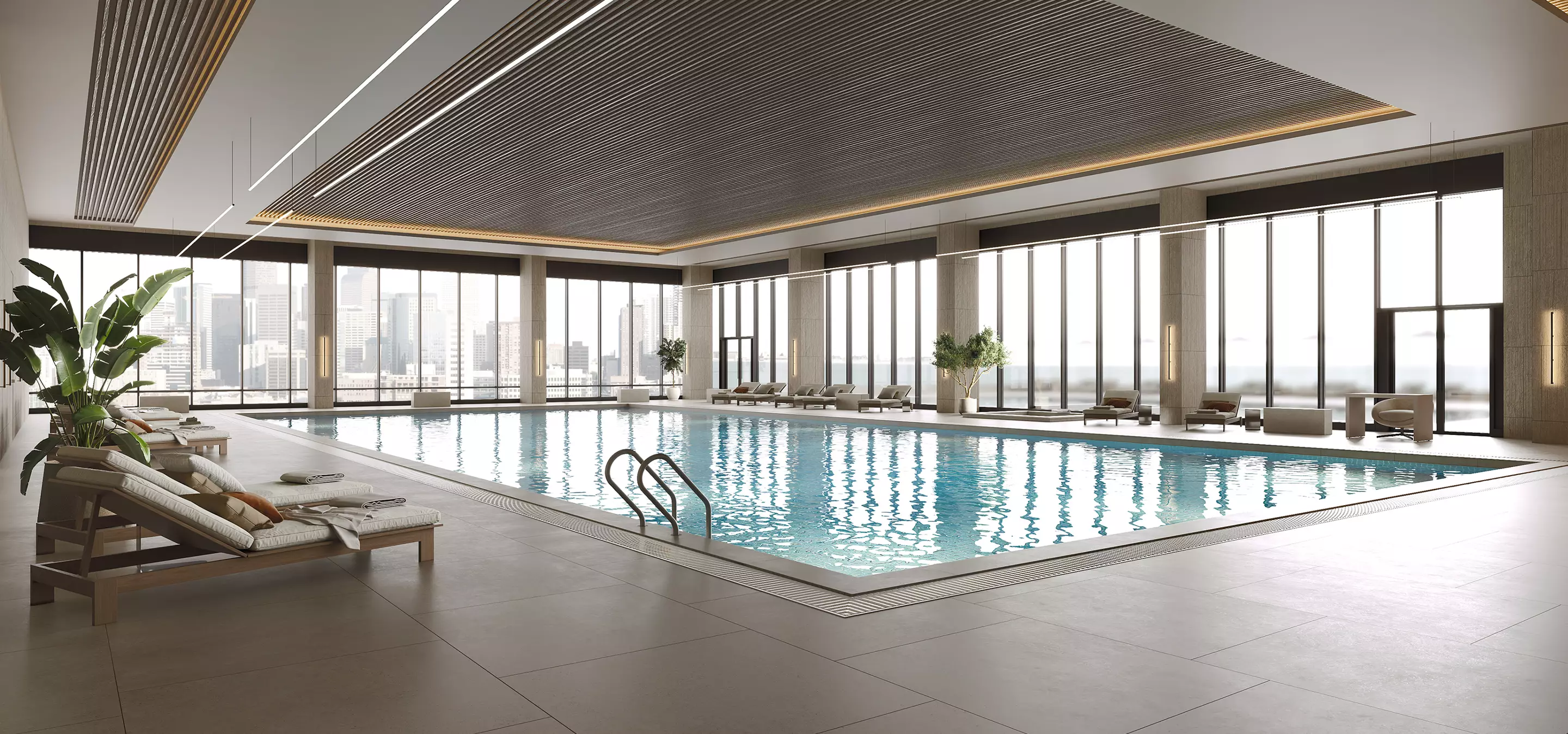 Pool rendering of a luxury indoor lap pool with lounge chairs and floor-to-ceiling city views