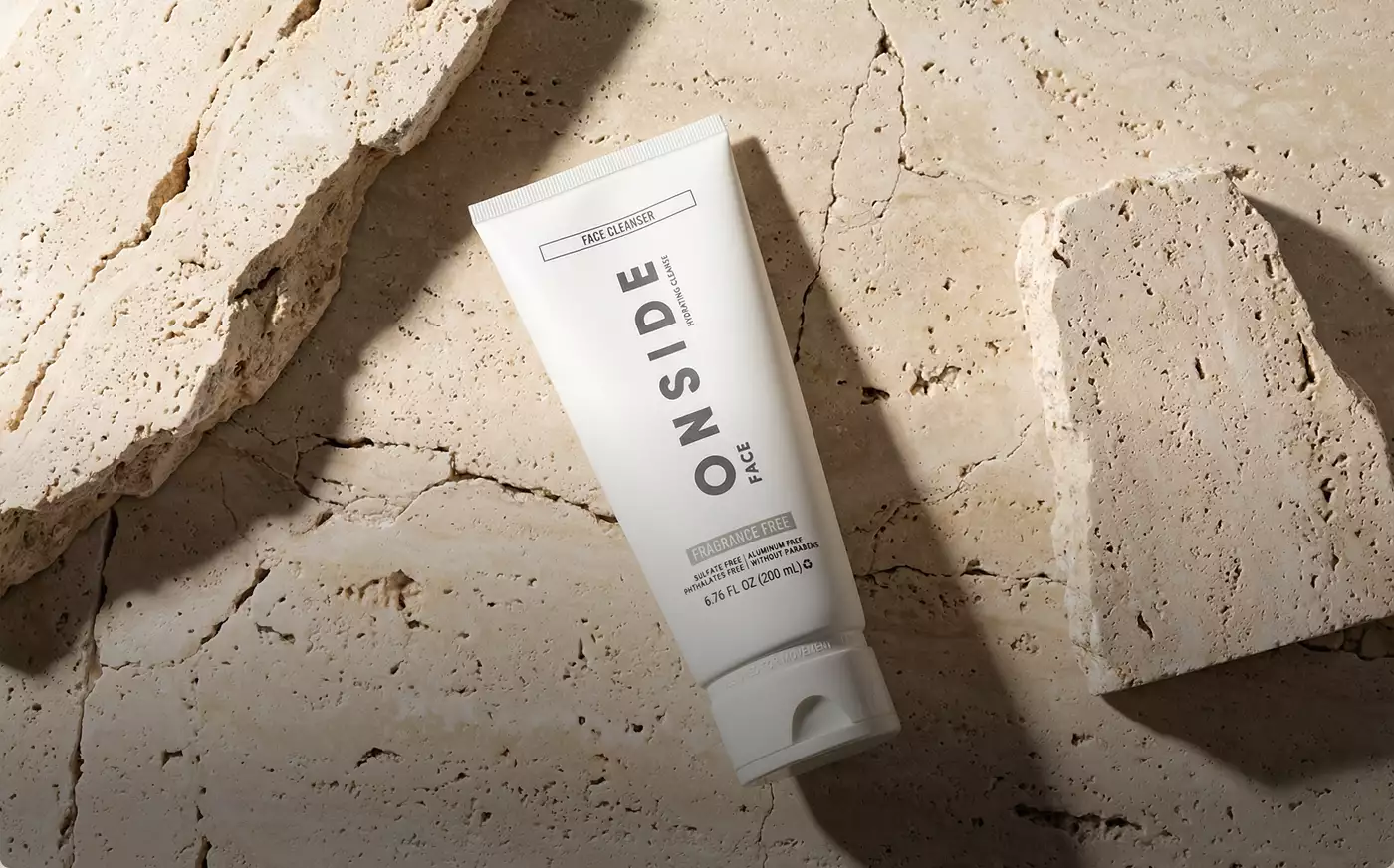 Face cleanser tube on stone surface Product modeling skincare flat lay detail