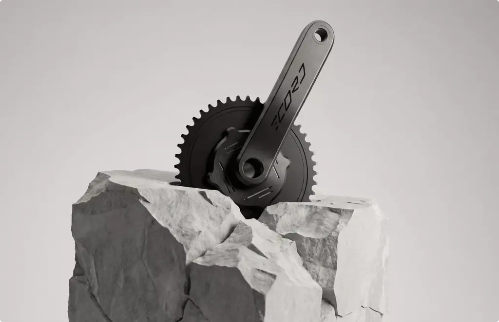Bicycle crankset placed on stone blocks, product rendering with clean neutral background