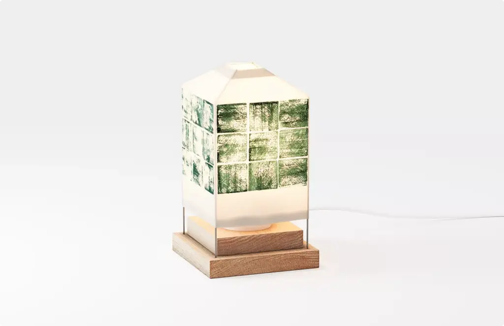Decorative table lamp with illustrated panels on base, product rendering minimal style