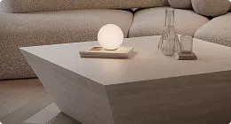 Minimal living room table with glowing lamp and decor, product rendering in soft neutral tones