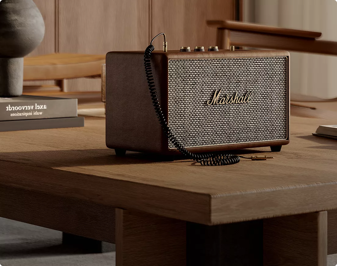 Vintage speaker on wooden table in home setting, product rendering with warm natural light