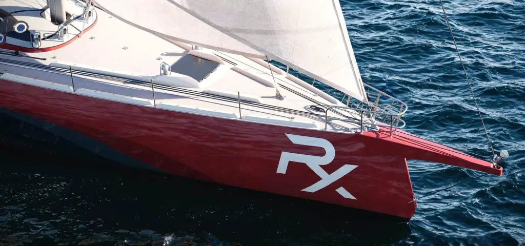 Sailboat 3d rendering close view of red bow and white sail over rippled ocean surface
