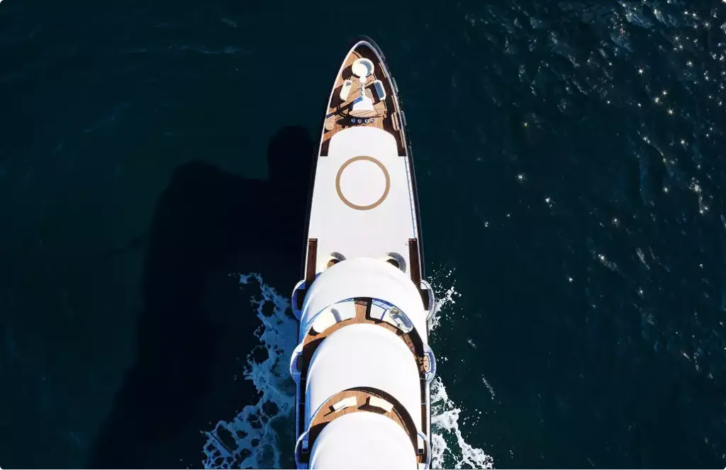 Aerial yacht rendering top view moving across dark blue water with streamlined deck layout