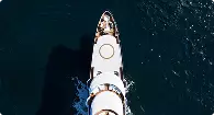 Aerial yacht rendering viewed from above moving across deep blue water with streamlined white deck