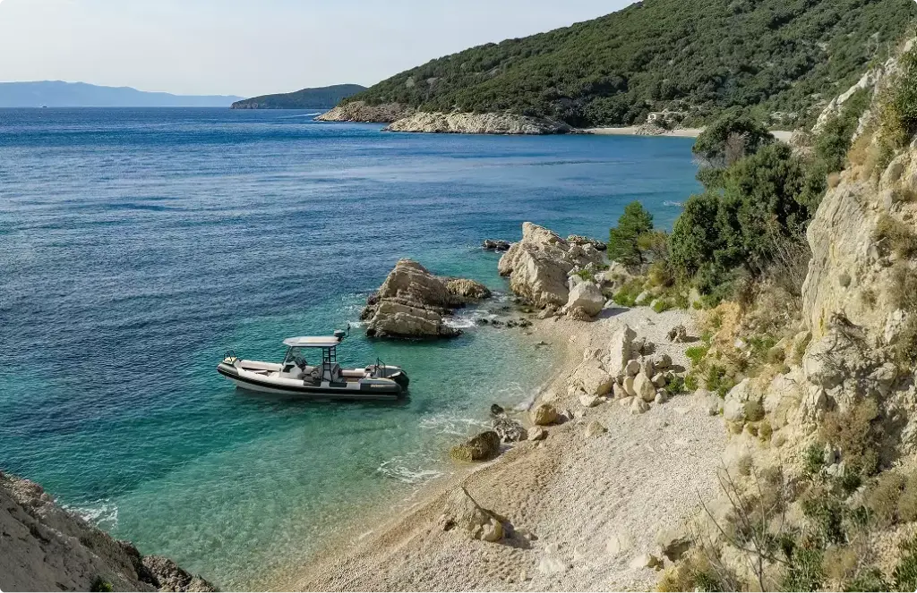 Small boat yacht rendering anchored near rocky beach with clear turquoise water and coastal cliffs