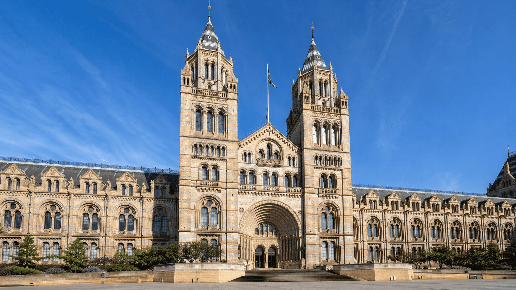 Victorian Architecture: A Complete Guide to Its History and Styles Natural History Museum facade in London with twin towers and Romanesque arches