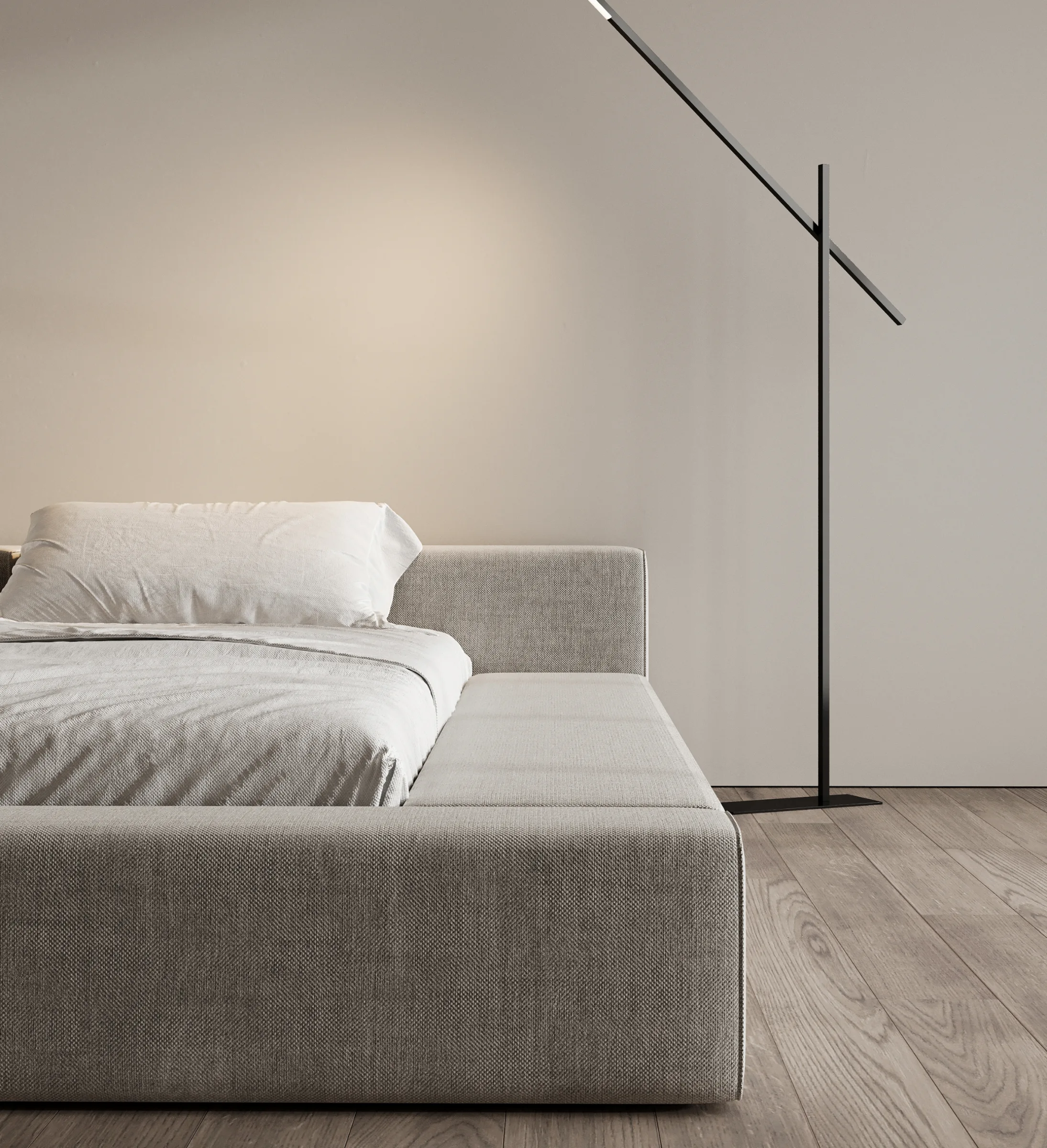Contemporary bedroom with upholstered bed, slim floor lamp, and neutral wall tones.