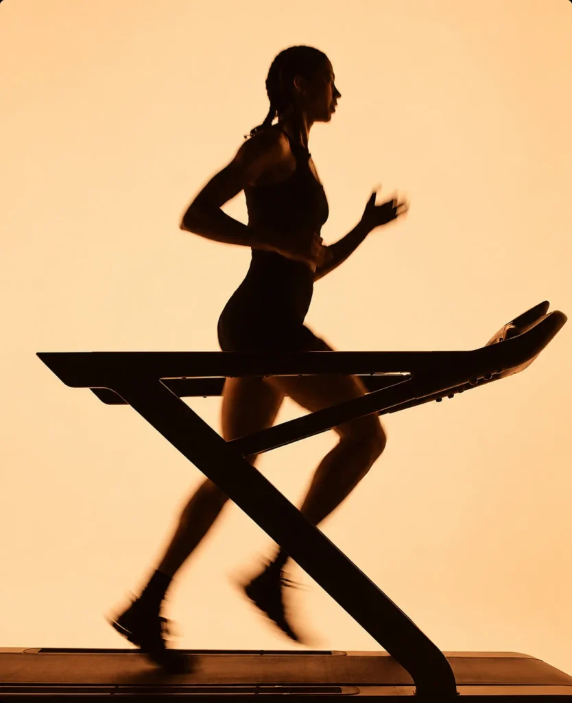 Endurance runner silhouette on a warm background, brand world.