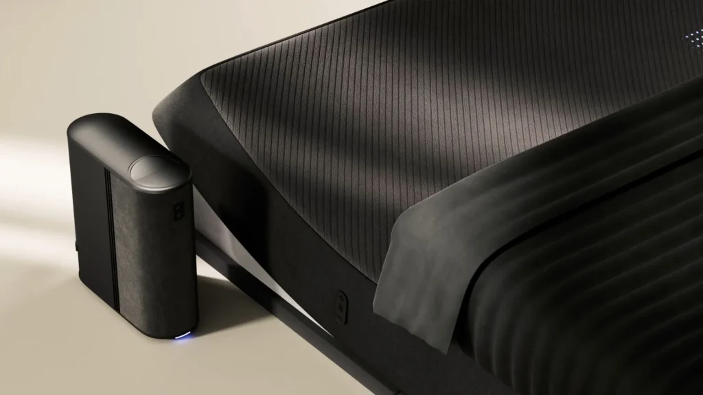 Product rendering of a black smart bed with a temperature-control hub