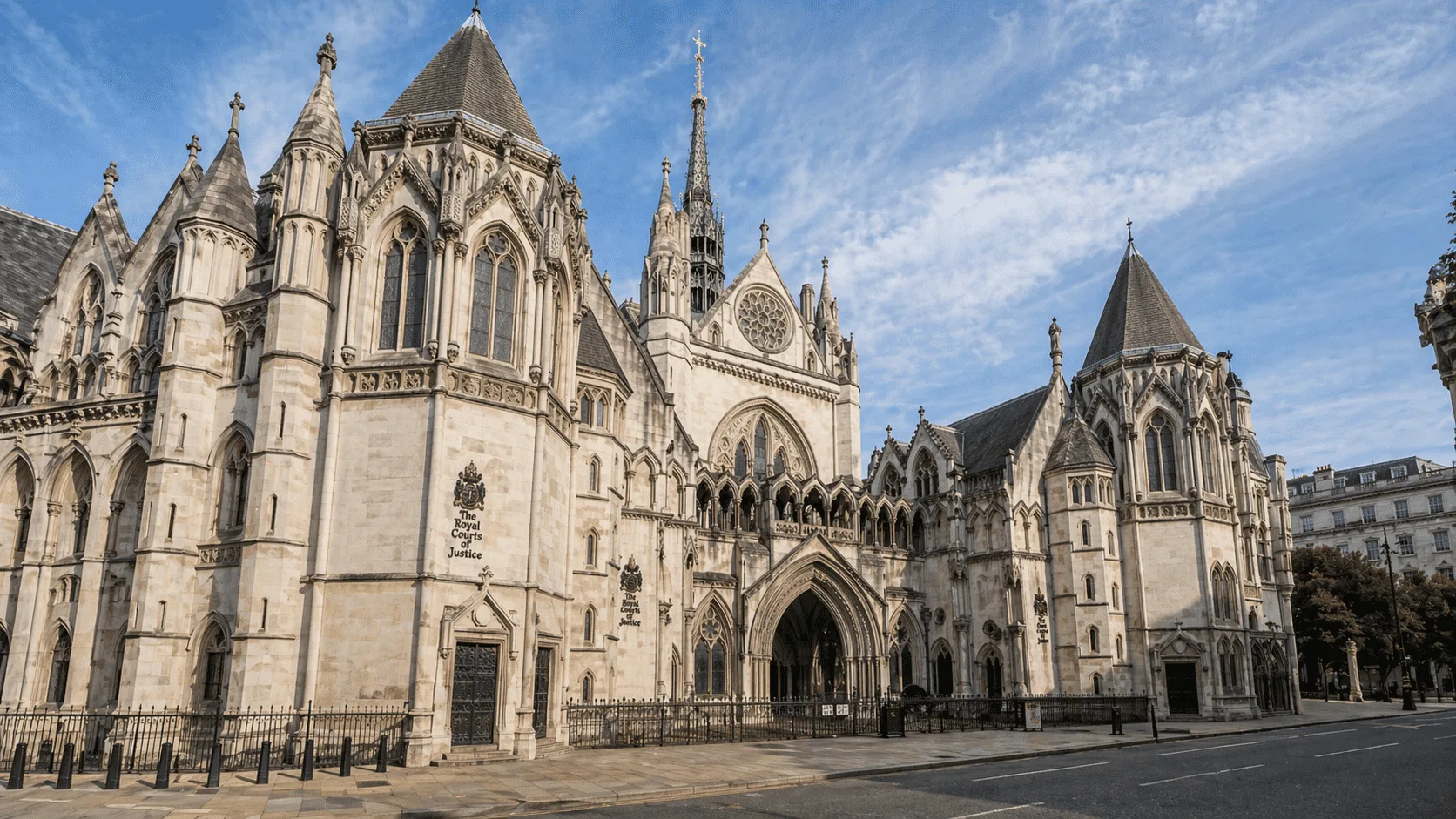 Victorian Architecture: A Complete Guide to Its History and Styles Royal Courts of Justice in London with Gothic arches, stone towers, and detailed facade